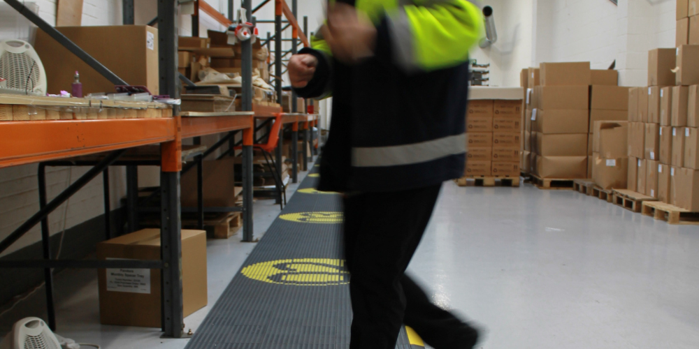 High-Traffic Warehouse Areas Example with person walking across warehouse